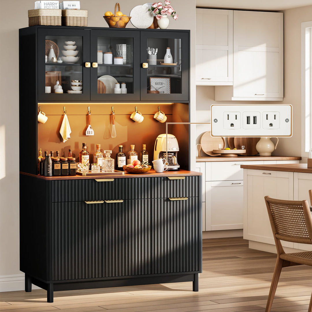 Black kitchen cabinet with wooden top in a modern kitchen setting