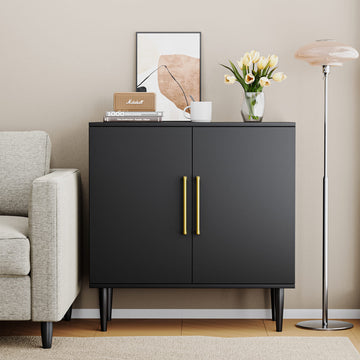 Black cabinet with gold handles in a living room setting